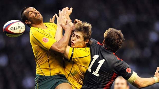 Australia's Kurtley Beale (left) and James O'Connor collide as they jump for the ball.