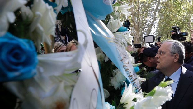 Lazio soccer team president Claudio Lotito lays a wreath outside Rome's Synagogue.