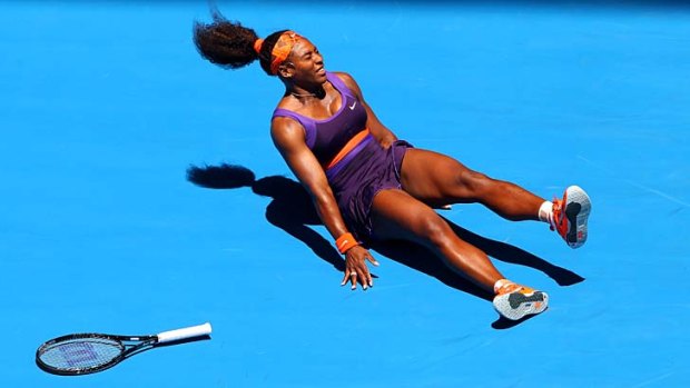 Down and out: Serena Williams injures her ankle in the first round.