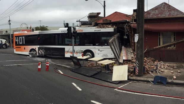 Bus smashes into North Melbourne takeaway shop. 