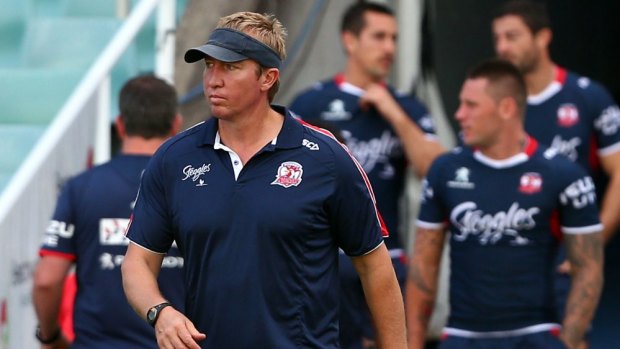 Standing by his player: Roosters coach Trent Robinson.