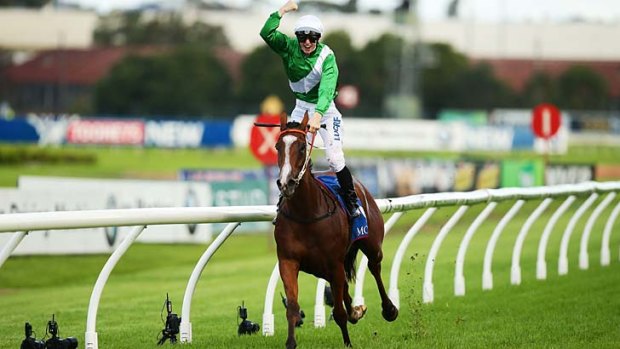 James McDonald celebrates after riding Mossfun to win the Golden Slipper at Rosehill Gardens on Saturday.