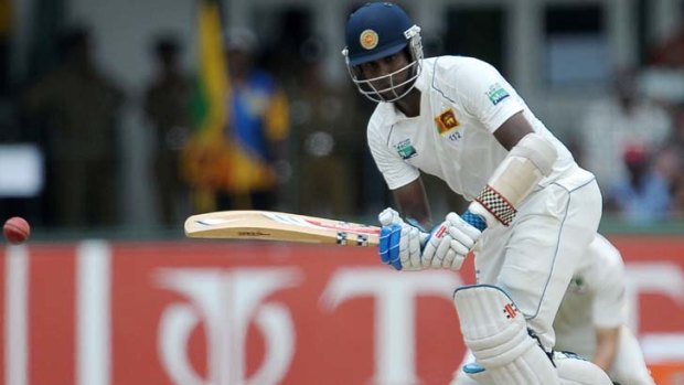 Unconquered ... Angelo Mathews' debut Test ton came at a price.