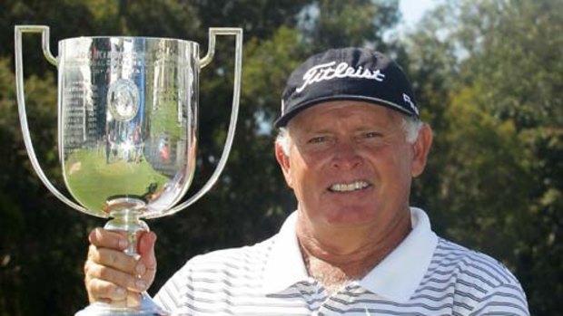 Peter Senior with the Joe Kirkwood Cup after winning a delayed Australian PGA tournament at Coolum yesterday.