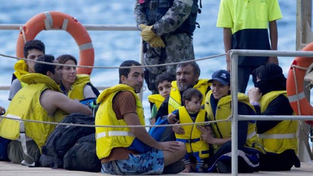 Uncertain future &#8230; the latest boatload of asylum seekers is ferried ashore to Christmas Island.