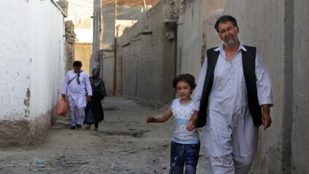 Left: Shir Ahmad in Kabul with his daughter Sadaf, 6. His son has left Afghanistan, never to return.