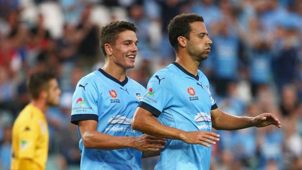 Easy win: Alex Brosque celebrates with George Blackwood after his second goal.