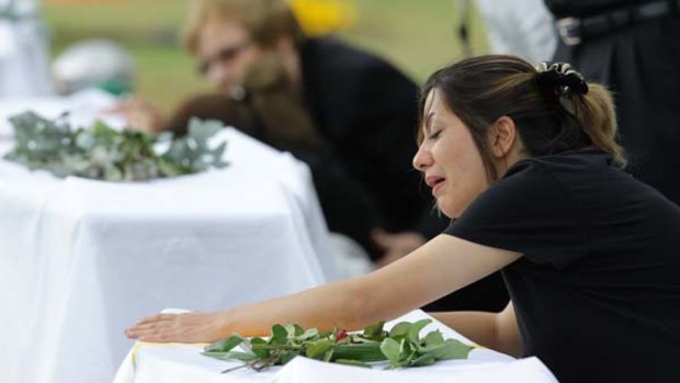 A grieving relative at the Castlebrook Cemetery.