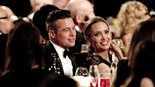Honoree Angelina Jolie (R) and actor Brad Pitt attend the 2013 Governors Awards.