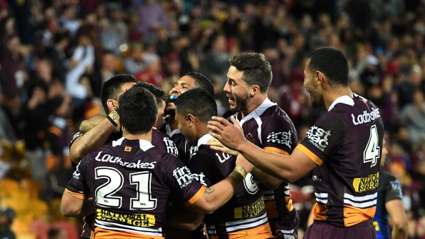 On a roll: Broncos players celebrate one of their many tries on Thursday night.