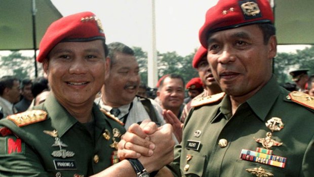 ''Think Putin'' &#8230; Prabowo Subianto, left, hands over leadership of Indonesia's special forces in 1998. Prabowo is looming ever larger as a prospective winner of Indonesia's 2014 presidential election.