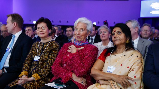 International Monetary Fund director Christine Lagarde (centre) listens to Donald Trump's speech.