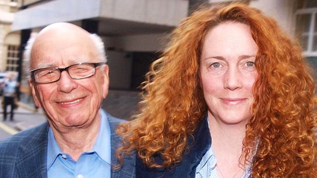 Rebekah Brooks  and Rupert Murdoch   leave from his London residence shortly after his arrival in  Britain on  July 10, 2011, to take personal charge of the phone-hacking scandal.