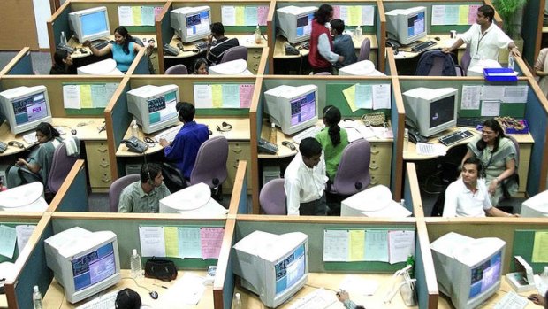 Indian employees work at a call center in the southern Indian city of Bangalore.