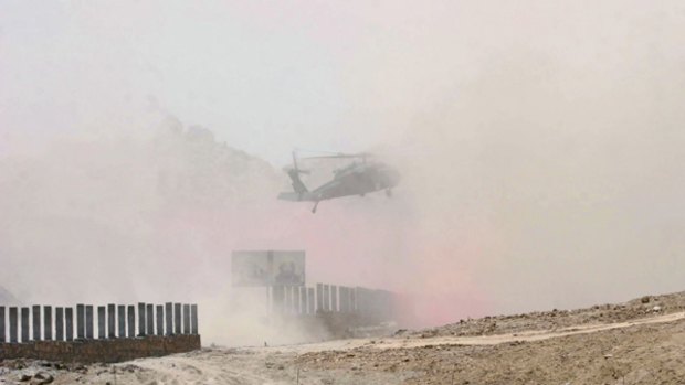 Into the fray: A medical helicopter from the International Security Assistance Force lands near the fighting in Afghanistan's southern Arghandab district.