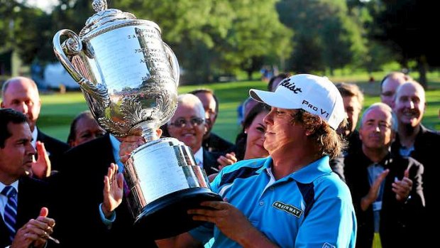 Jason Dufner of the United States celebrates with the Wanamaker Trophy after his victory at the PGA Championship this year.