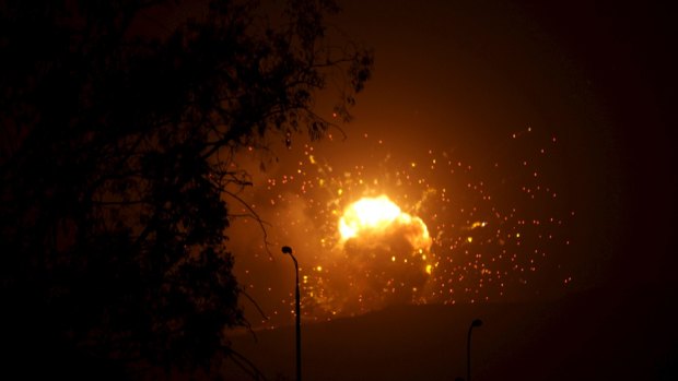 Fire is seen at a military site after it was hit by an air strike on the Faj Attan mountain of Sanaa on Saturday.