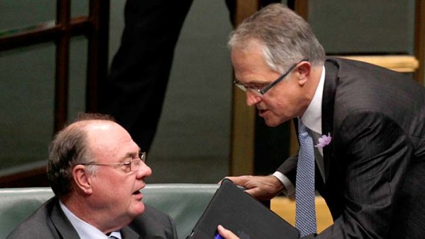 My point is ... Malcolm Turnbull has a word with the Opposition Whip Warren Entsch during question time in Canberra yesterday.