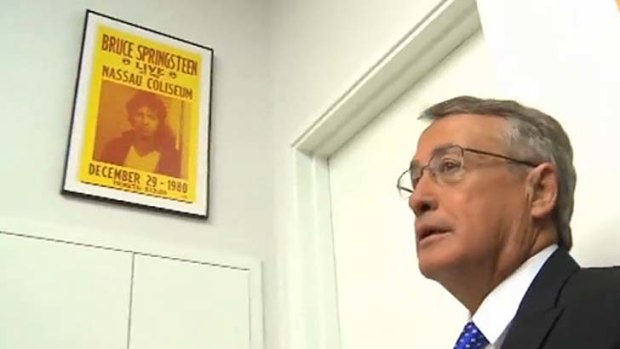 Acting Prime Minister Wayne Swan with a Bruce Springsteen poster in his office.
