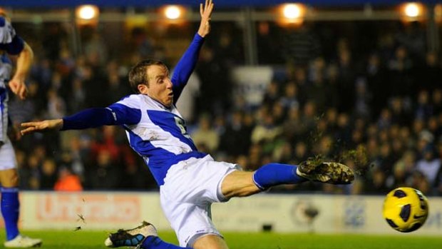 Point made . . . Lee Bowyer of Birmingham City scores the equalising goal against Manchester United.