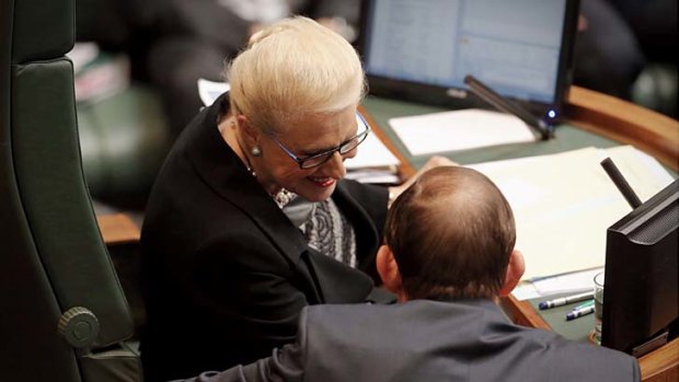 Prime Minister Tony Abbott talks with Speaker Bronwyn Bishop during question time.