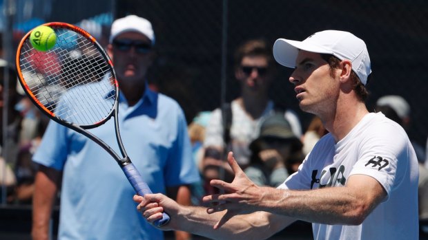 Split: Andy Murray training in Melbourne as Ivan Lendl watches in the background.