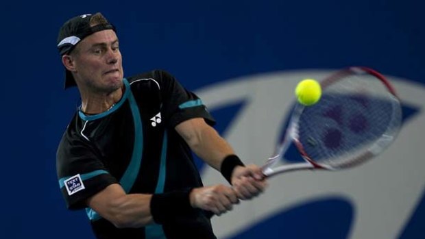 On the way back ... Lleyton Hewitt rips into a backhand in his straight-sets victory over Kazakhstan's Andrey Golubev in the Hopman Cup in Perth last night.