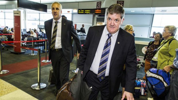 Detective Inspectors Mick Sheehy and Russell Oxford arrive at Brisbane Airport to question Roger Rogerson.