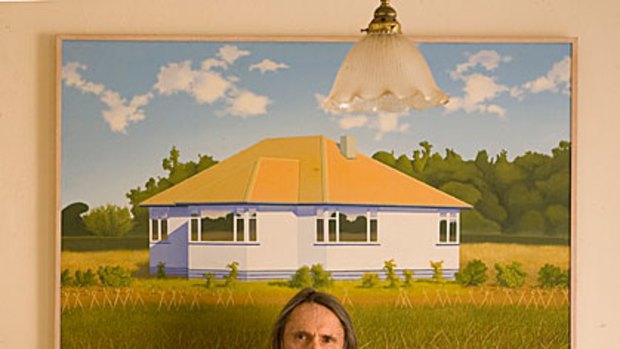 Suburban idyll ... Reg Mombassa with a version of his 1974 painting House at Beach Road with Kirk's Bush, which hangs on his kitchen wall.