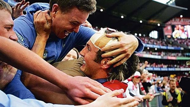 Jude Bolton celebrates Sydney's drought-ending 2005 premiership.
