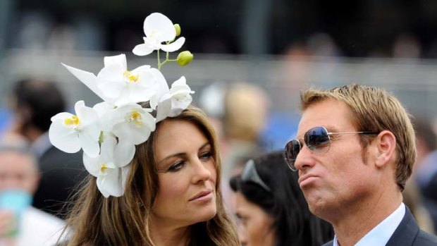 Shane Warne and Liz Hurley ... tried to escape the media