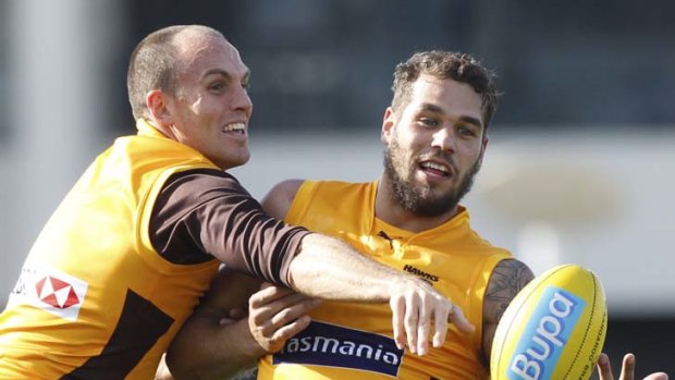 Take that: Cameron Bruce spoils a hirsute Buddy Franklin at training.