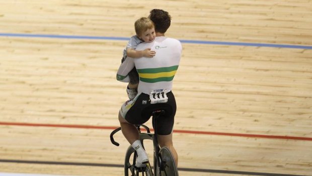 Shane Perkins celebrates with his son Aidan after winning the Men's Team Sprint Final.