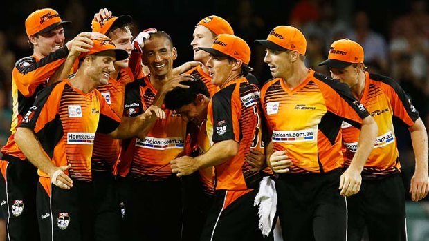 The Scorchers celebrate their win.