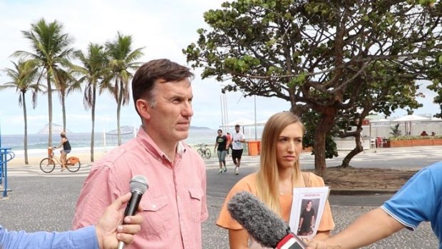 Rye Hunt's uncle Michael Wholohan and girlfriend Bonnie Cuthbert speaking with reporters in Rio de Janeiro.