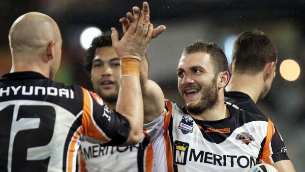 All smiles ... Robbie Farah high-fives Liam Fulton after his pass helped him cross the line for a first-half try.