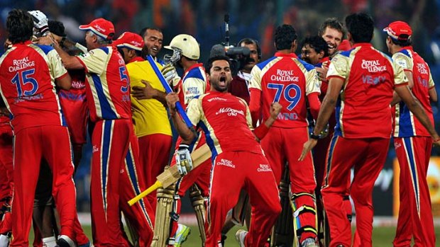 How sweet it is: Royal Challengers Bangalore players celebrate their victory over South Australia.