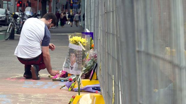 Tributes have been left at a makeshift memorial.