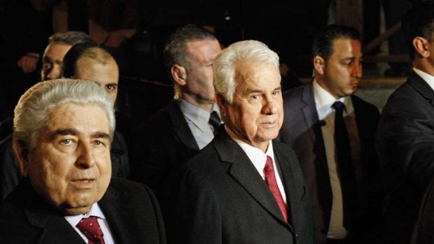 Cyprus' President Dimitris Christofias, left, and Turkish Cypriot leader Dervis Eroglu.
