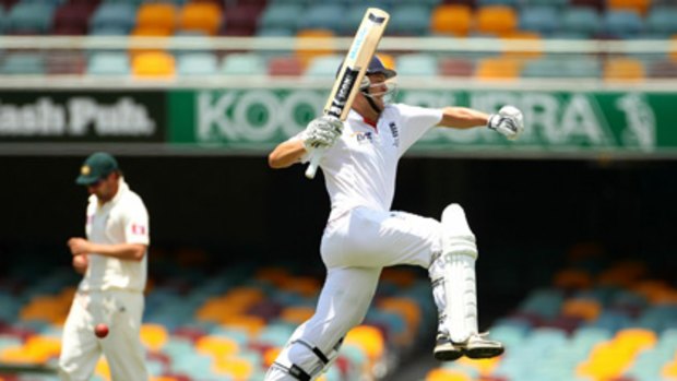 Jonathan Trott leaps in joy after reaching his century.