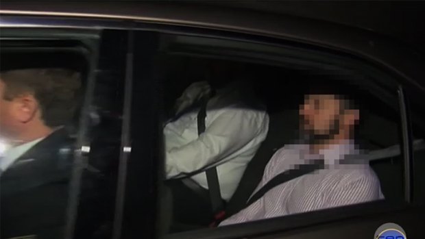 Police take Gerard Baden-Clay away to be charged with the murder of his wife Allison. Screengrab from Channel 10.