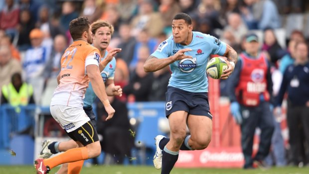 Israwel Folau stretches out for the Waratahs against the Cheetahs in South Africa last June.