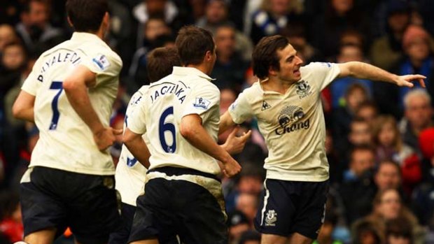 Leighton Baines of Everton celebrates after levelling the scores at 1-1 late in extra time against Chelsea.
