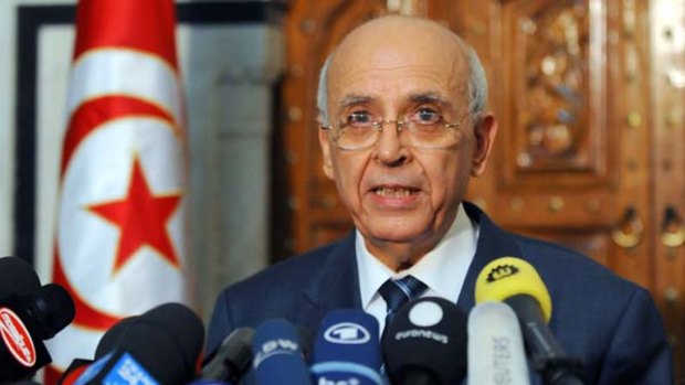 Tunisian Prime Minister Mohamed Ghannouchi announces the new transitional unity government last week.