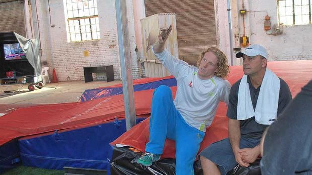 A relaxed Steve Hooker discusses technique with his coach Alex Parnov inside his secret Perth training facility.