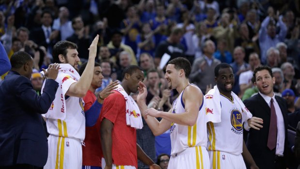 Hot shot: Klay Thompson is congratulated by Golden State teammate Andrew Bogut.