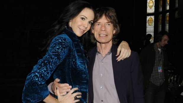 Designer L'Wren Scott and Mick Jagger pose at Fashion Week in New York City in 2012.