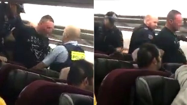 The man was escorted off the plane by police in Perth.