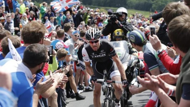 Crowded climb: Jens Voigt of Germany ascends Buttertubs pass.