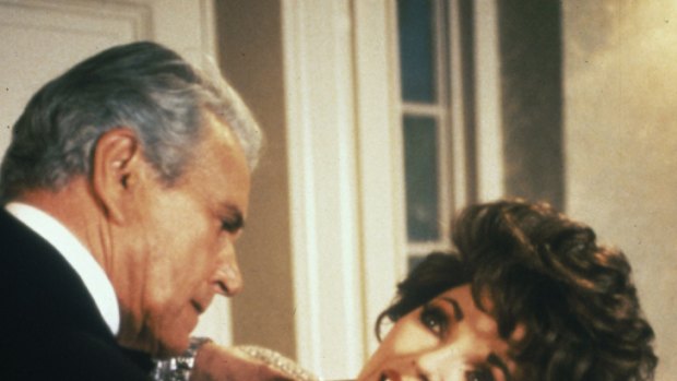 Dynasty co-stars "didn't care for me" ... Joan Collins and John Forsythe play out their antipathy.